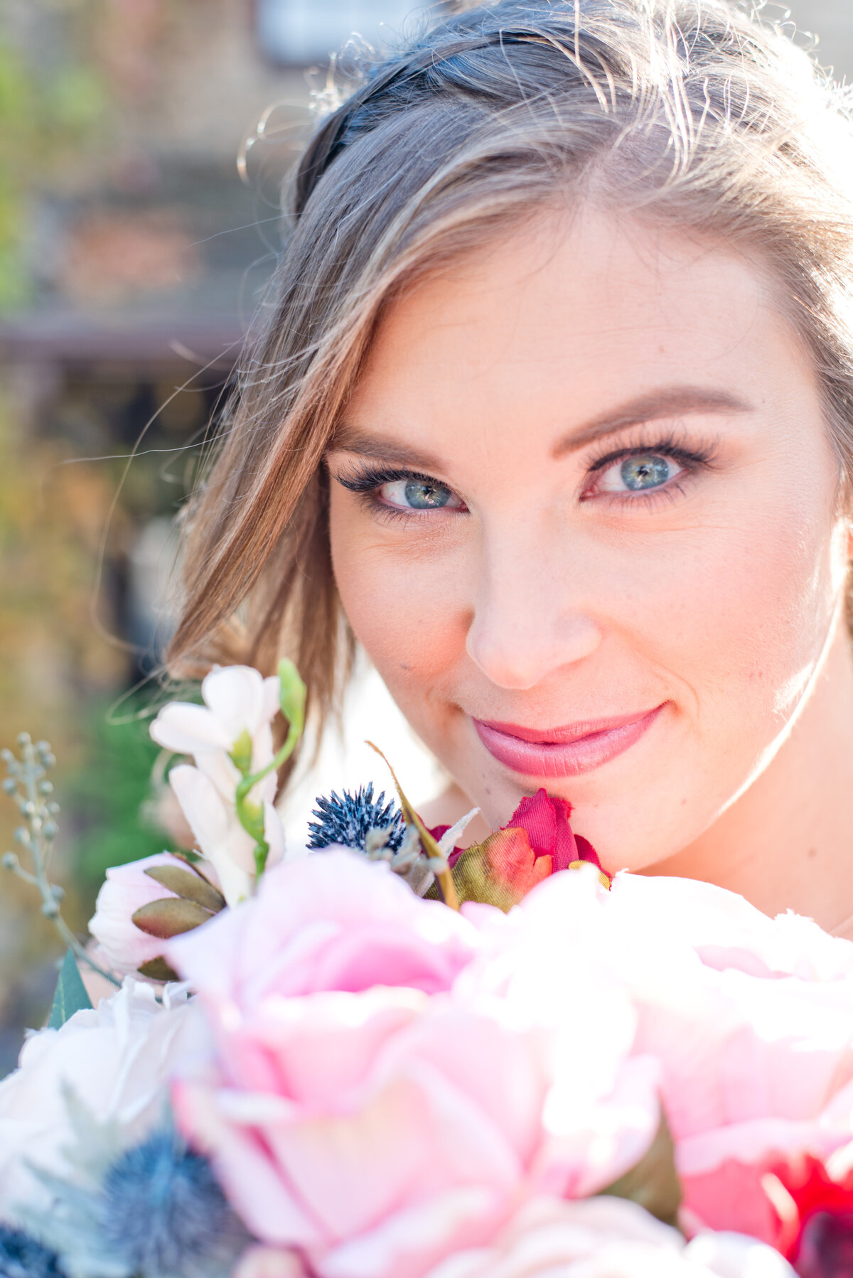 Fort Worth bride holding colorful bouquet and smiling