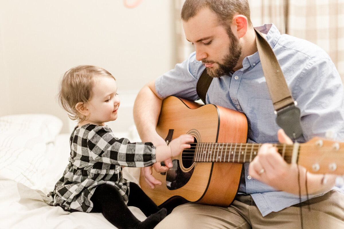 my husband and daughter playing guitar