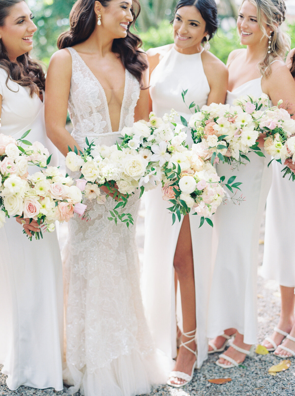 Bride and bridesmaids wearing white. Mostly white and green wedding flowers with touches of pale pink. Thomas Bennett House bride.