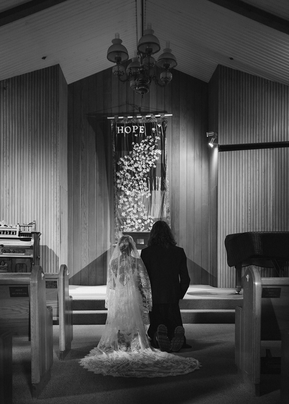 Yosemite Valley Elopement Chapel pray kneeling BW