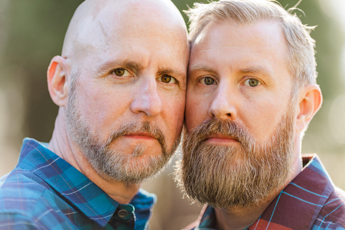 Engagement photo of two men looking intensely at camera LGBTQ Engagement photos in Woodinville WA photo by Joanna Monger Photography