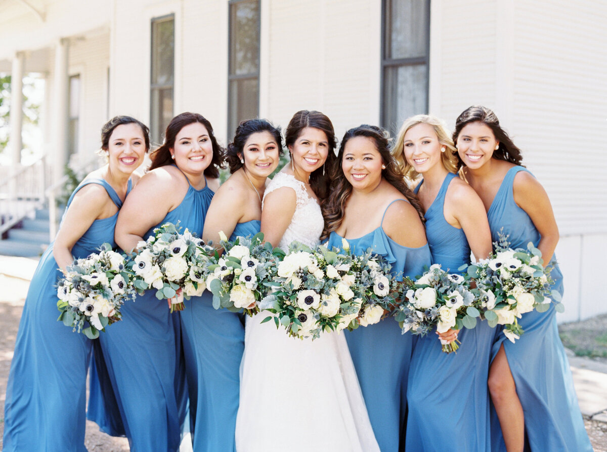 Bridesmaids in light blue with white bouquets