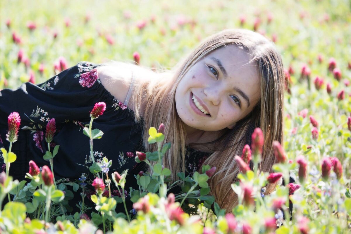 teenage portrait in flower field