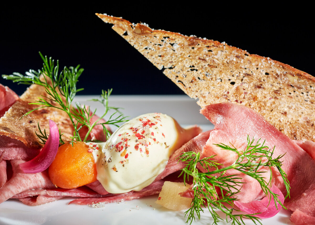 Cheese, meat and bread on a plate