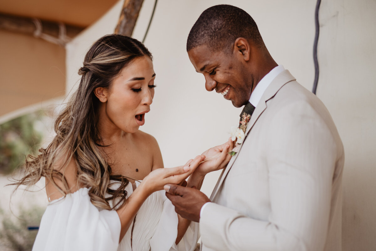 Utah elopement photographer captures woman surprised about necklace