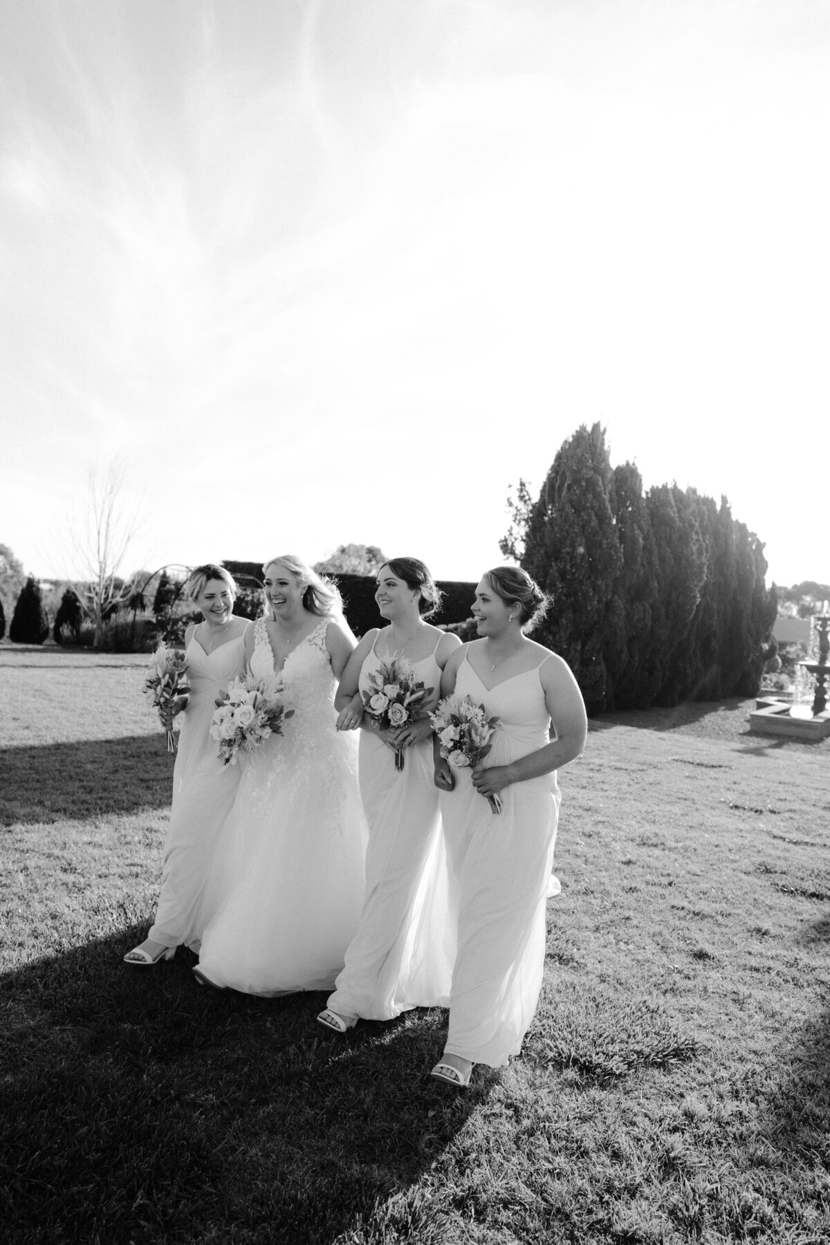 Bridemaids walking with the bride on her wedding day in Canberra