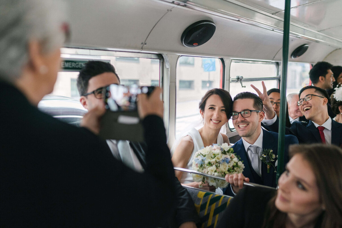 A candid moment with guests on a wedding bus