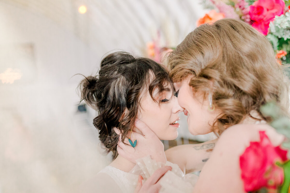 The Mill in Chetek Eau claire wedding photographers capture lgbtq couple kissing at their wedding day