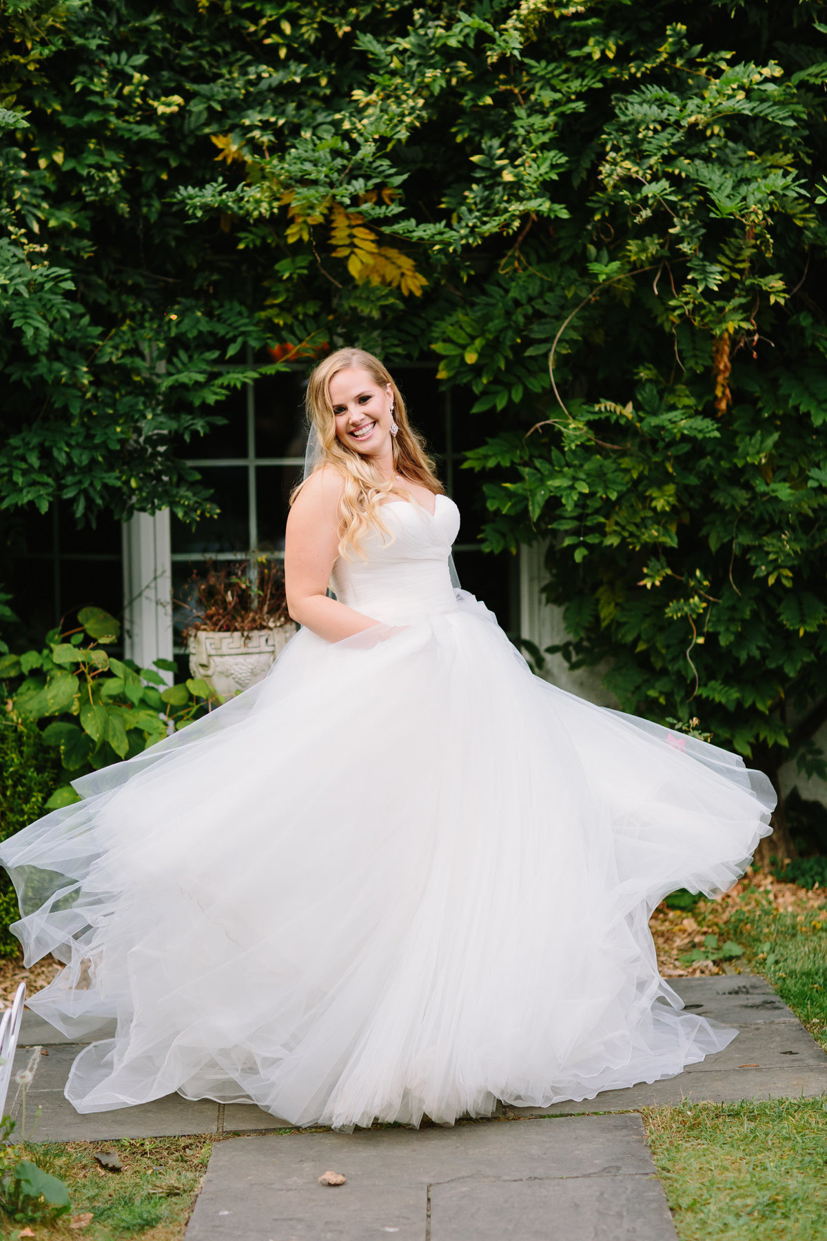 Beautiful bride twirling in princess dress