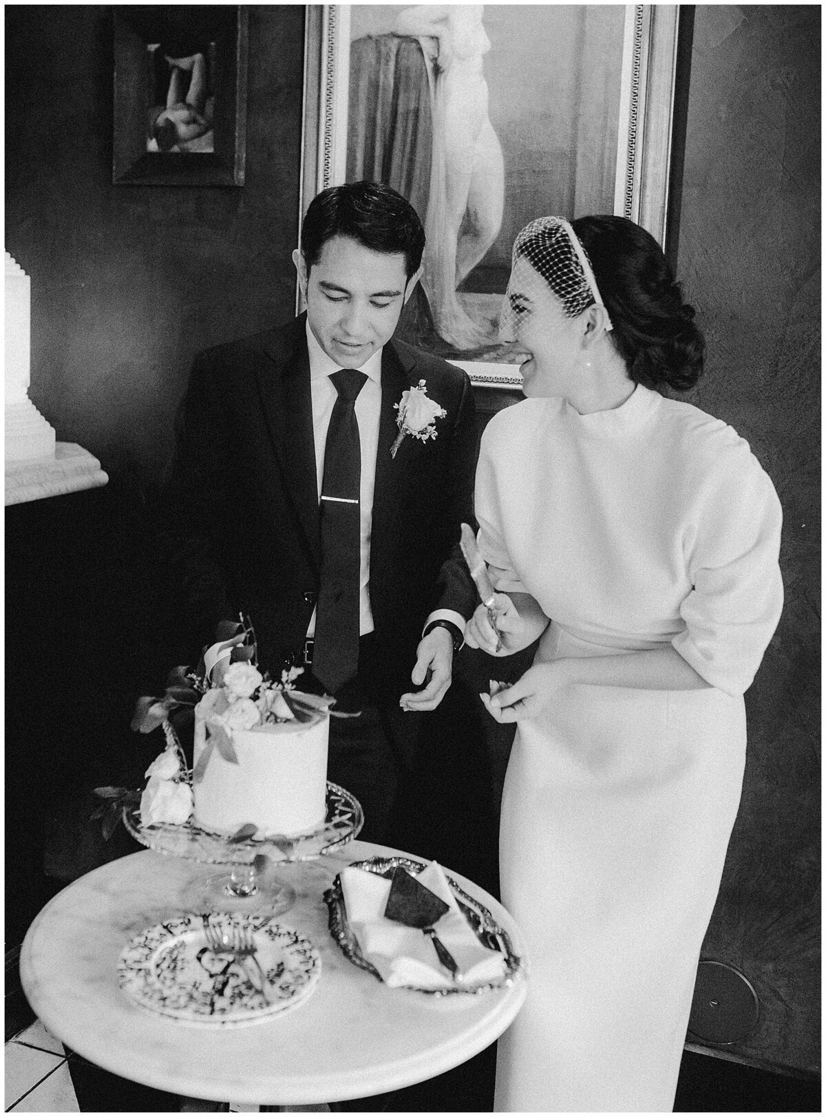 bride and groom cutting cake at Hotel Saint Cecilia Austin