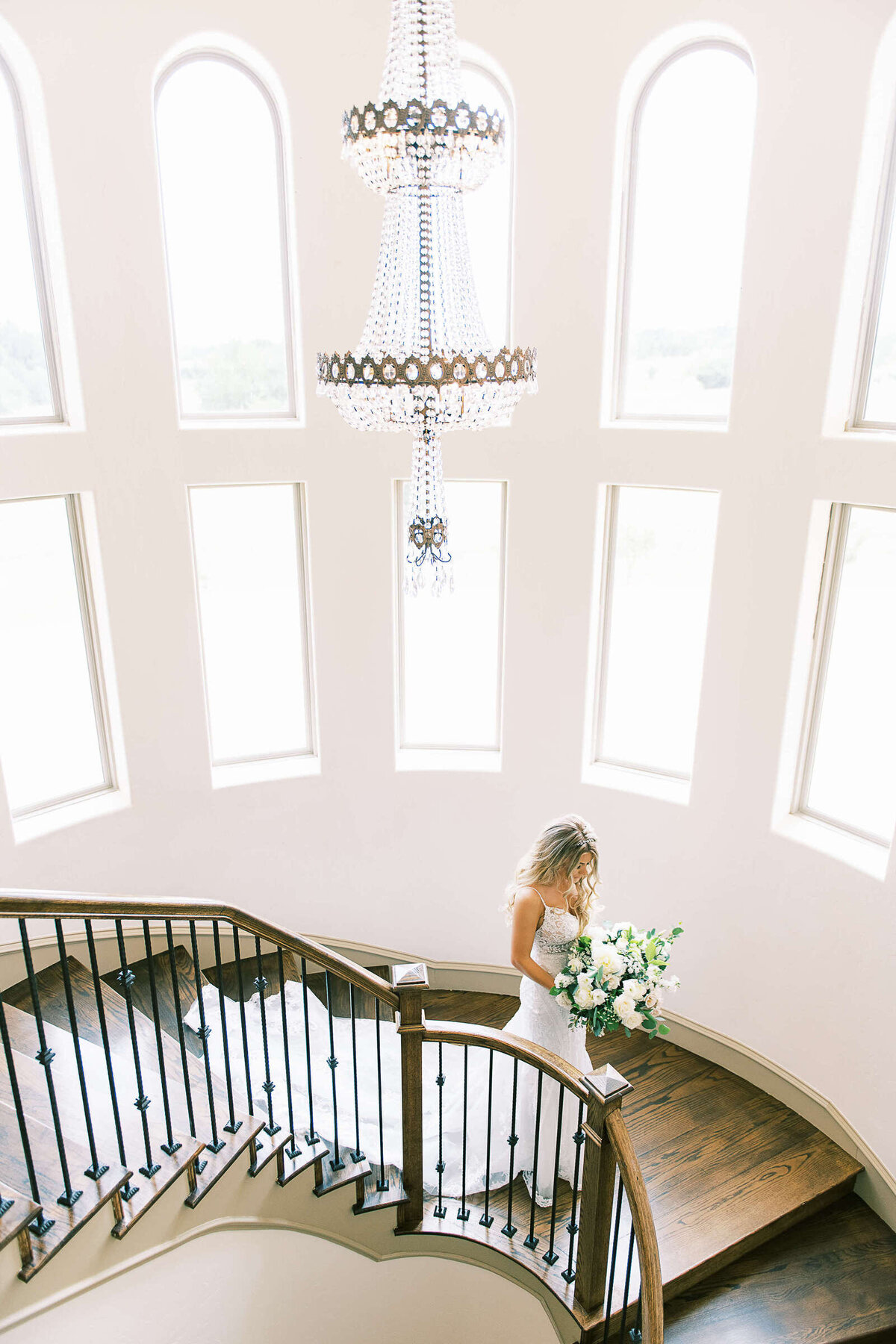 Bride descends down the stairwell at D'Vine Grace Vineyard wedding venue