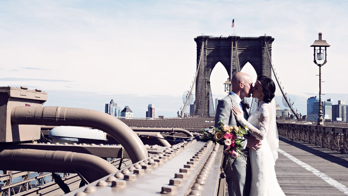 A Bride and Groom on Brooklyn Bridge in New York City