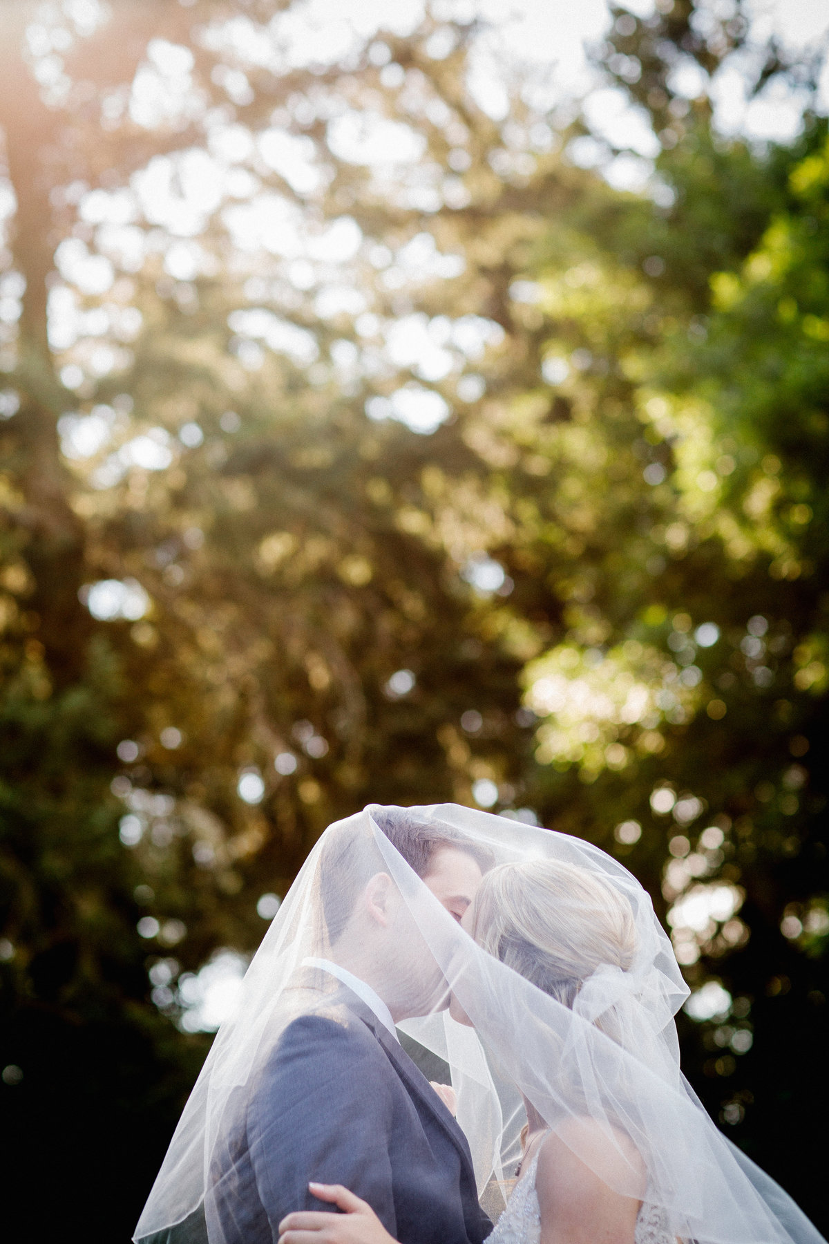 Oregon Winter Wedding Venue - Groom under Brides Veil