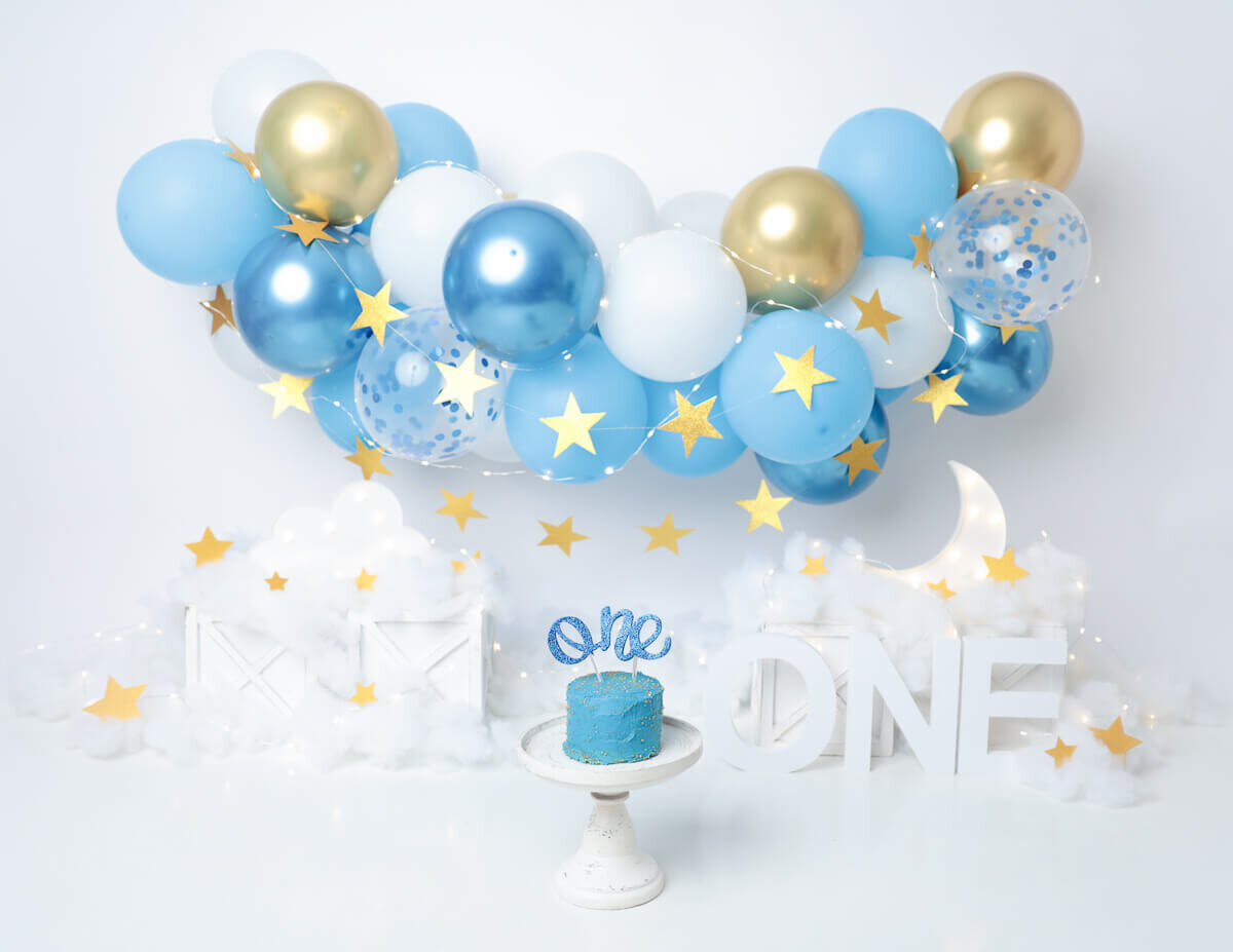 A blue and gold balloon-themed cake smash in Rochester, NY.