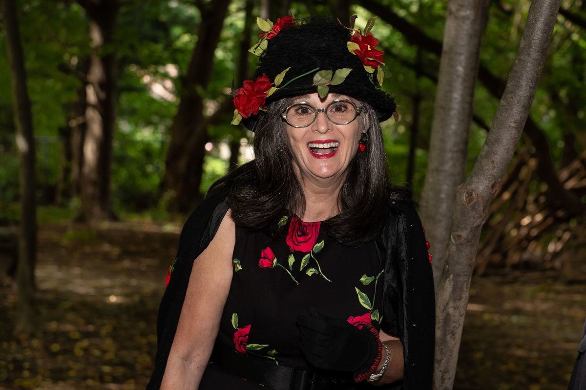 woman shows up to reception in crazy black flowered hat