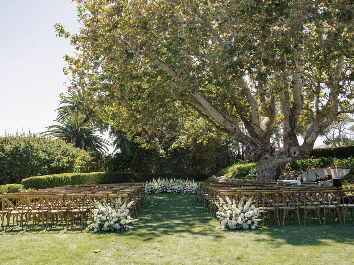 The ceremony site full of Primrose and Petal's floral arrangements.