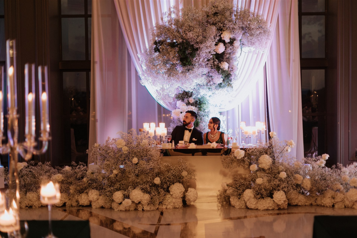 wedding-reception-green-babysbreath-ivory-roses-candelabras-2