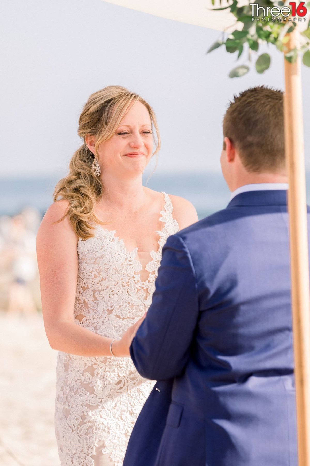 Bride smiles at her Groom after the ring was placed on her finger