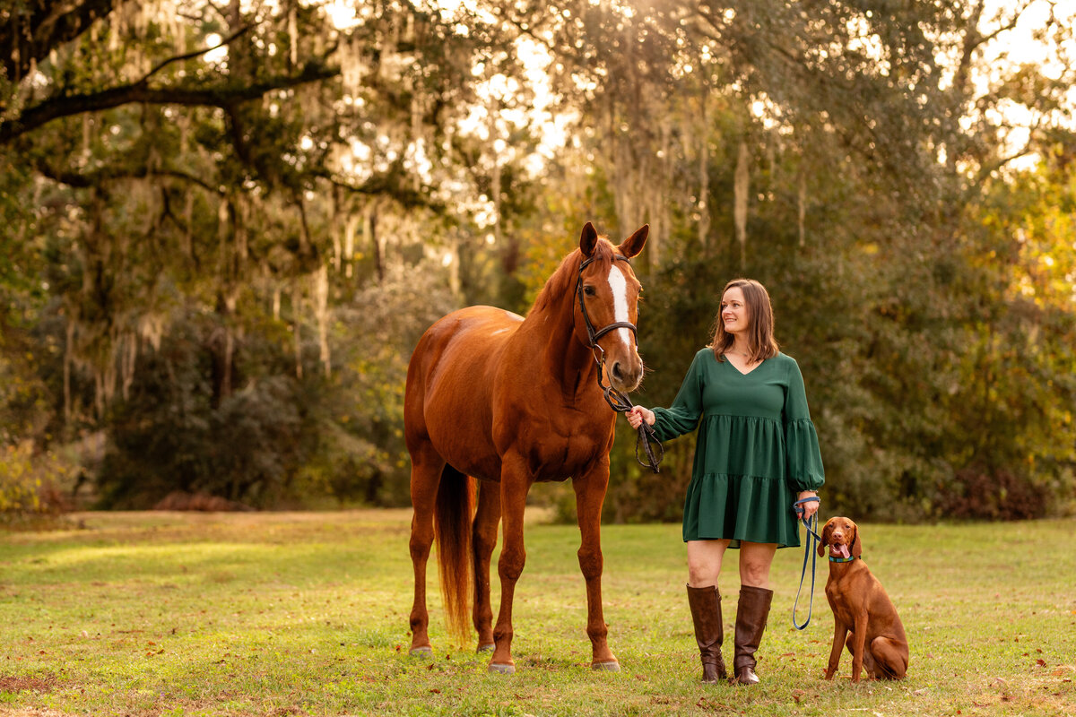 Tallahassee horse photographer takes photos at Cavallo Farms of woman with her horse and dog.
