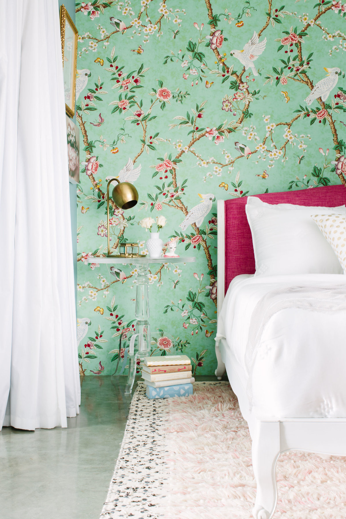 Floral chinoiserie wallpaper bedroom with pink headboard