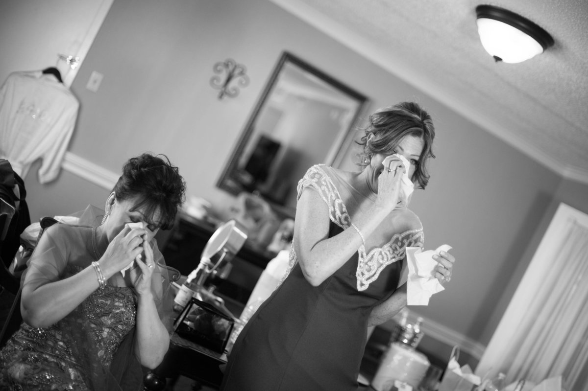moms seeing bride dressed for first time