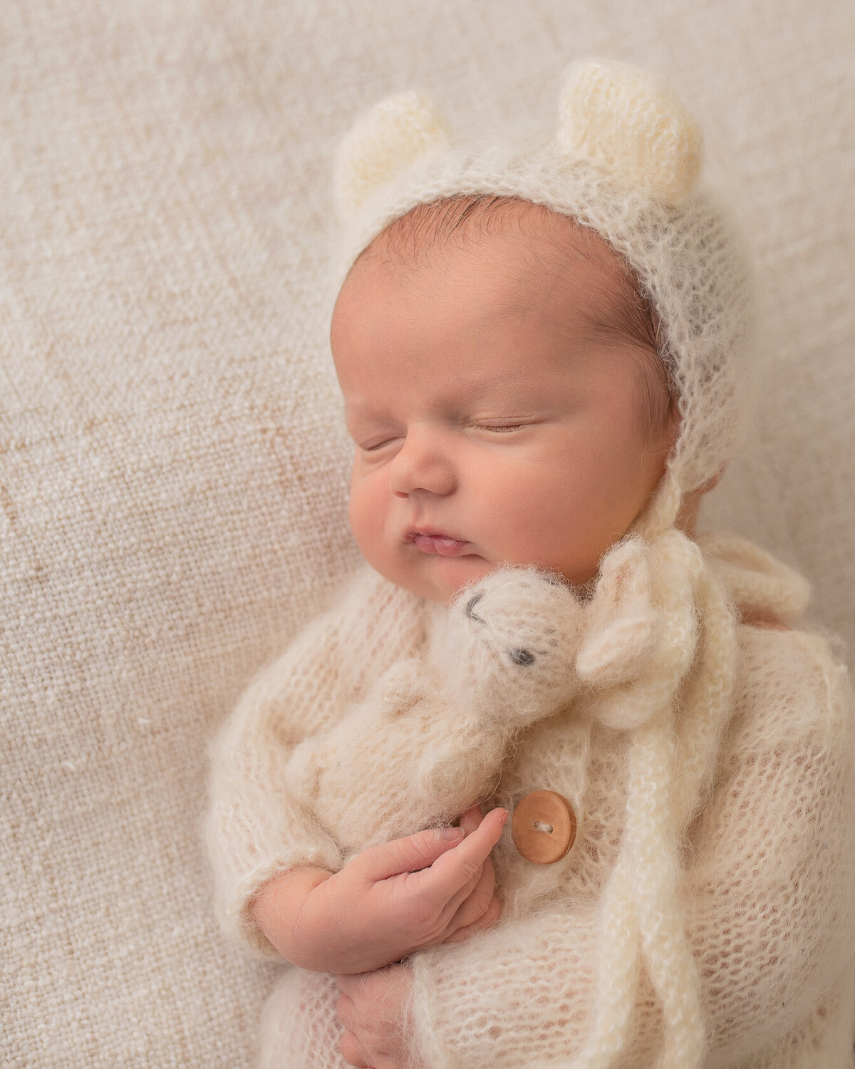 newborn photoshoot with bunny friend by Laura King