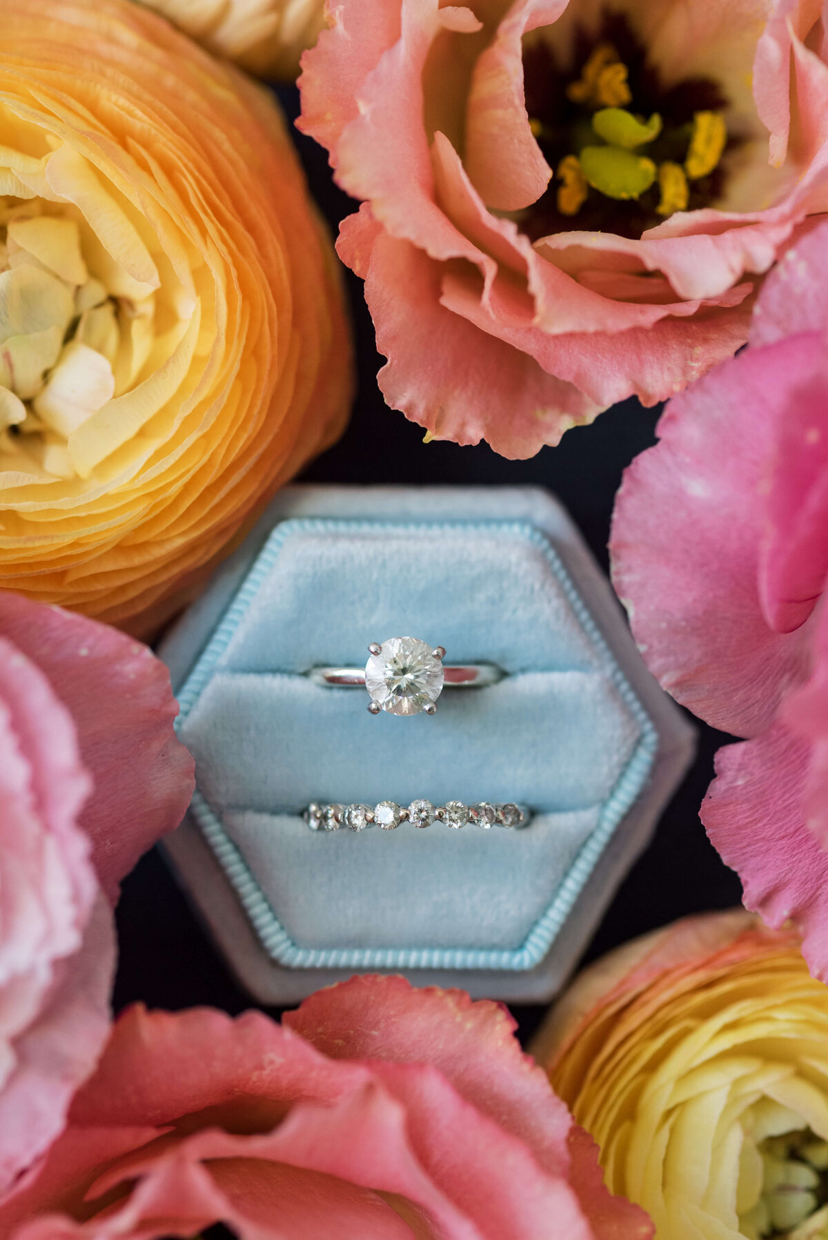 Wedding rings surrounded by florals for Oceanstone Resort Wedding in Nova Scotia