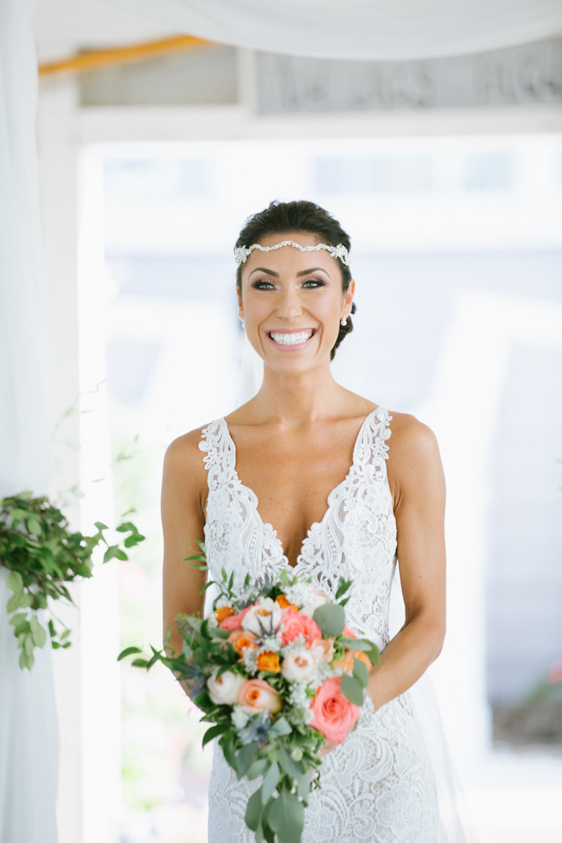 bride wearing a lazzarro wedding gown during her first look