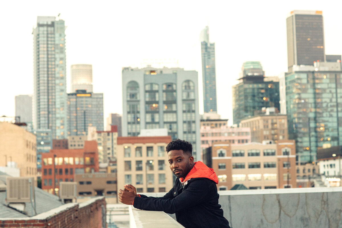 Portrait Photo Of Young Black Man Standing At a Rooftop Los Angeles