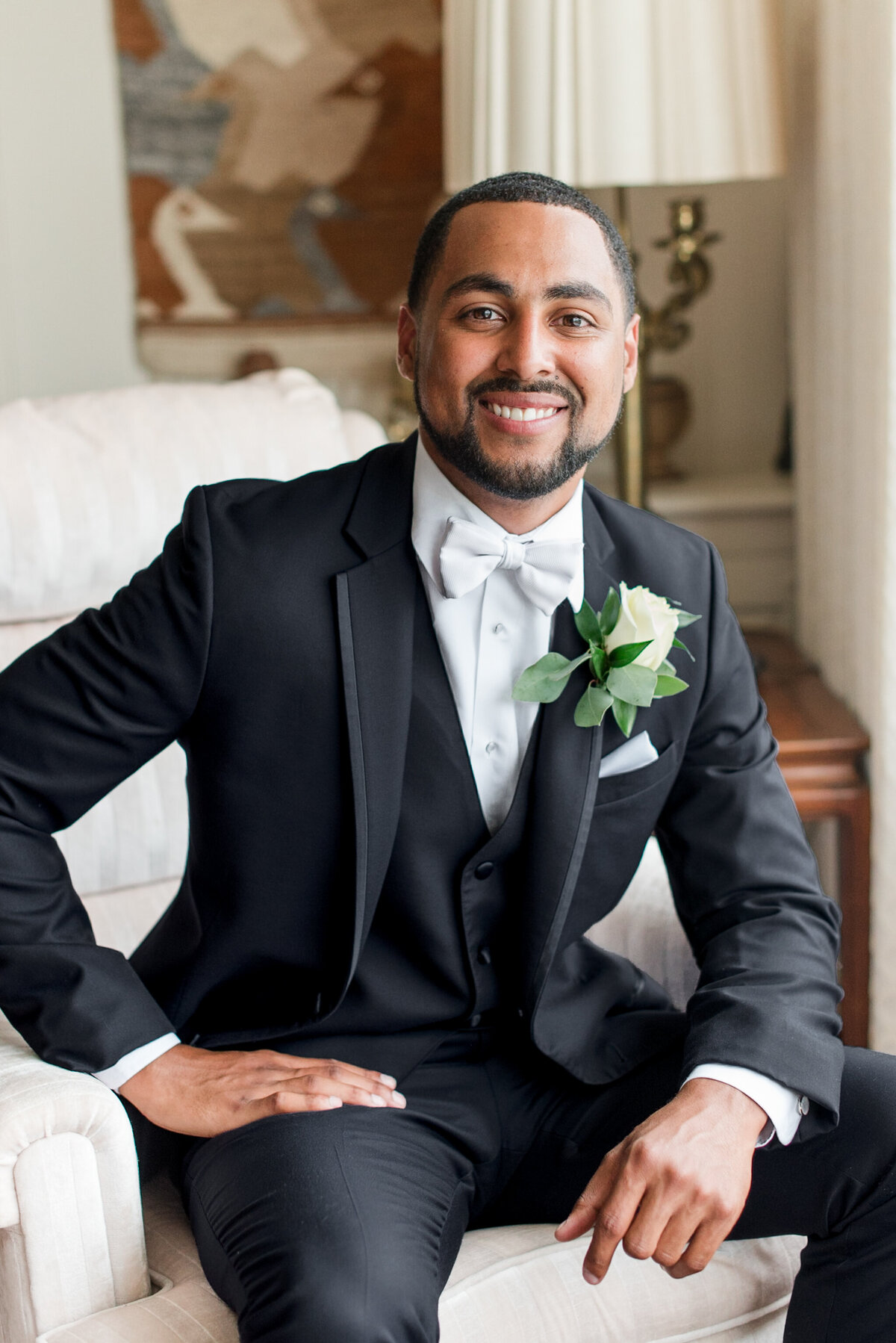 groom on wedding day in black tuxedo