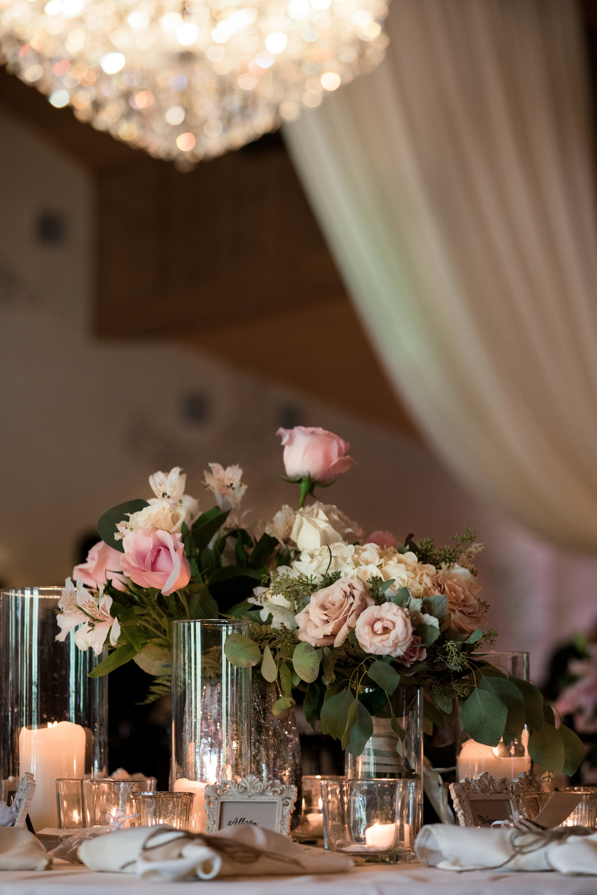 Austin wedding photographer chandelier of gruene table setting