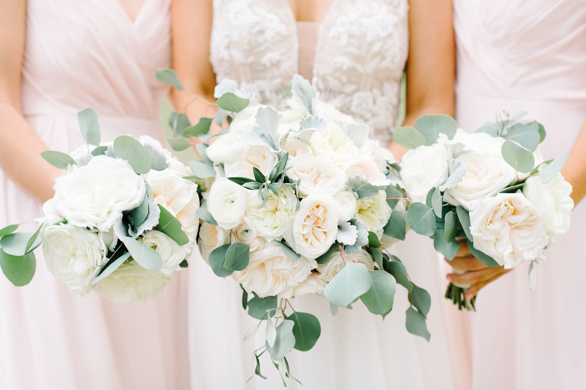 Bride and Bridesmaids in Blush Pink Dresses Holding Ivory White Blush Greenery Bouquets