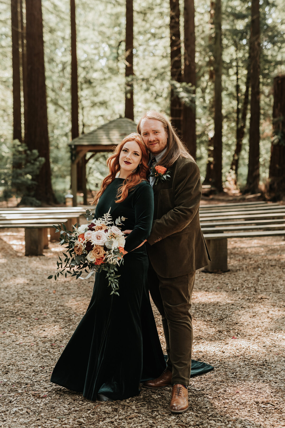 Groom hugs Bride in the Redwoods at their Forest wedding at Two Woods Estate