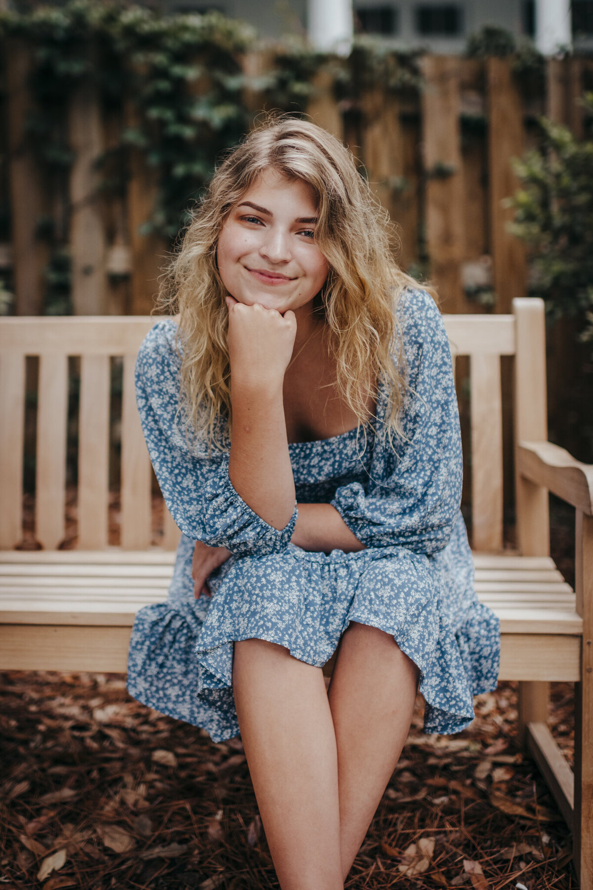 girl sitting on a bench at low country portrait session
