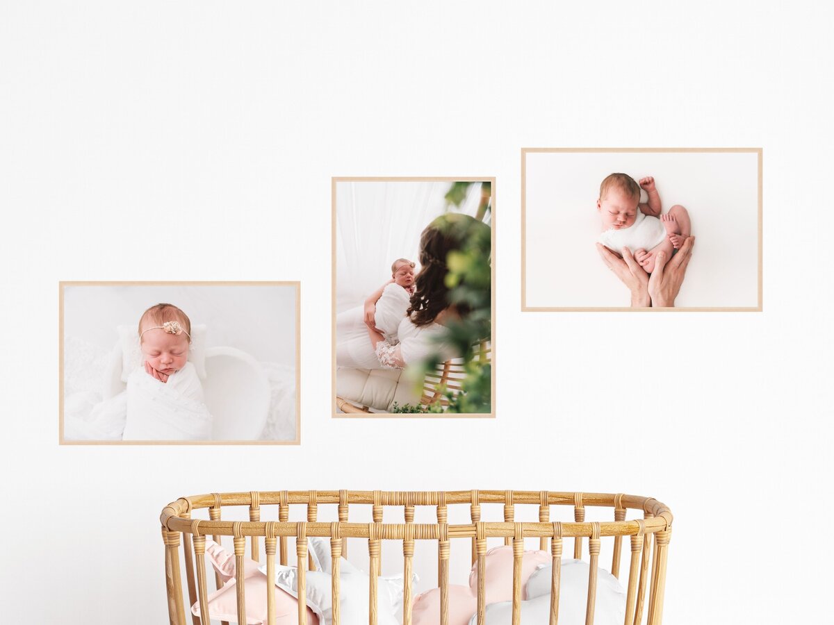 Three framed photographs of a newborn baby and its parents, displayed above a crib in a nursery.