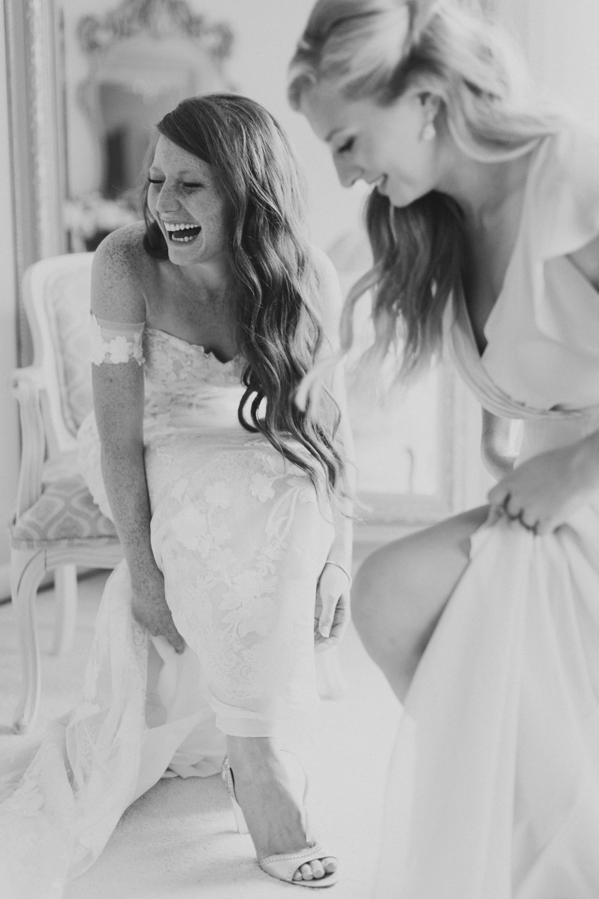 bride getting ready on wedding day with bridesmaids