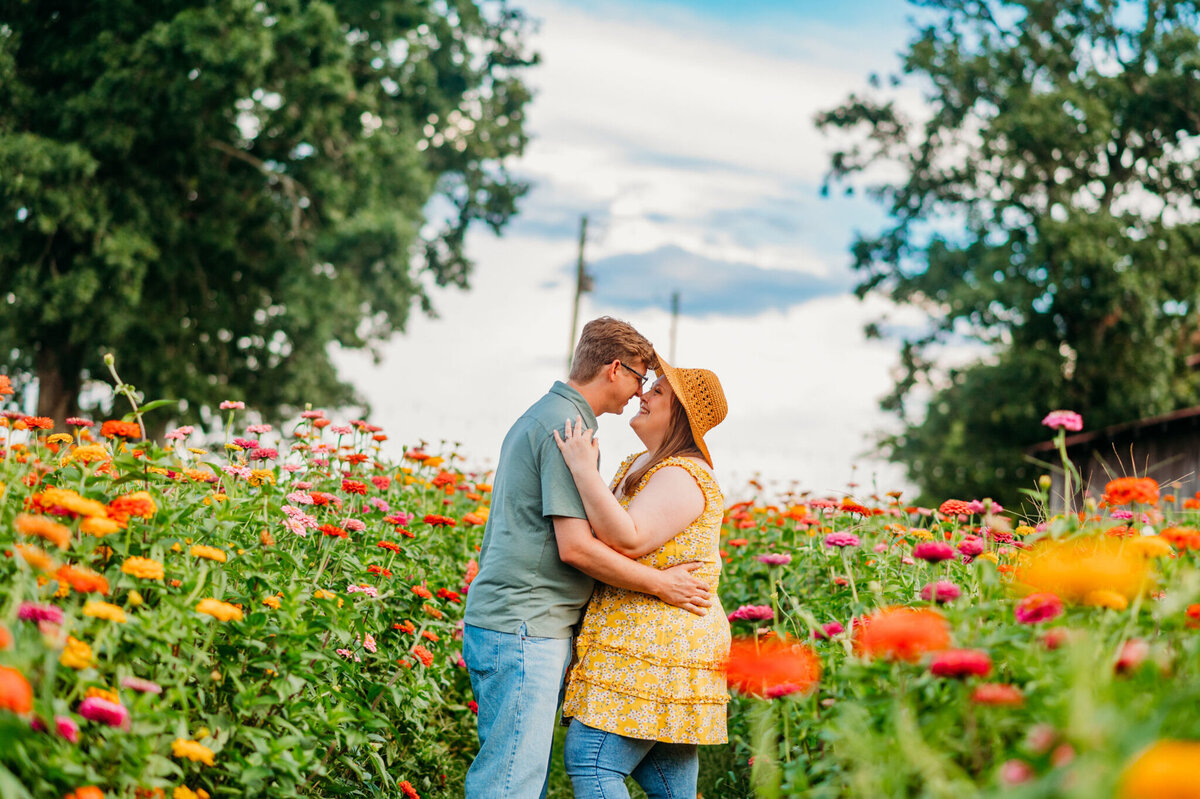 photo of man and woman in a zinnia field