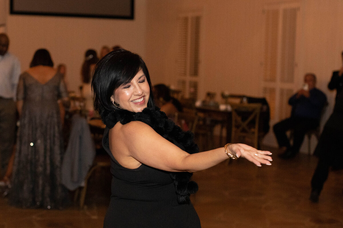 wedding photographer in Fort Worth captures woman dancing at reception