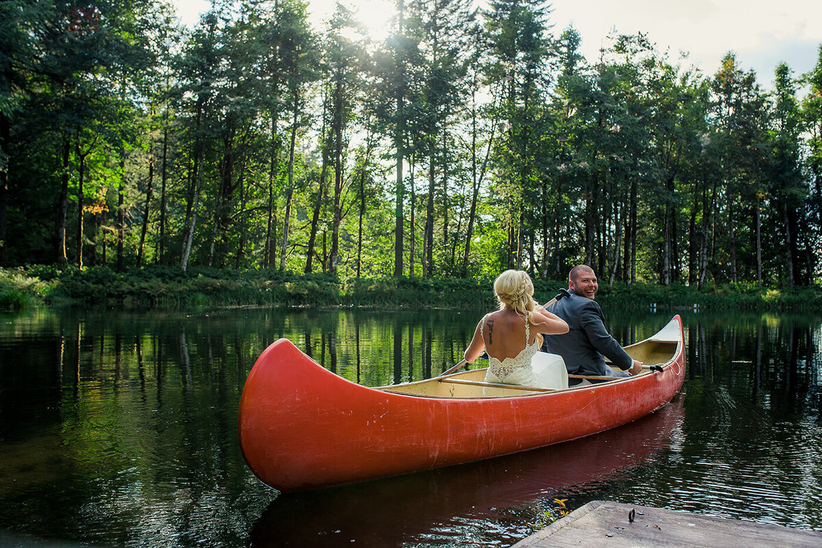 bride and groom in canoe