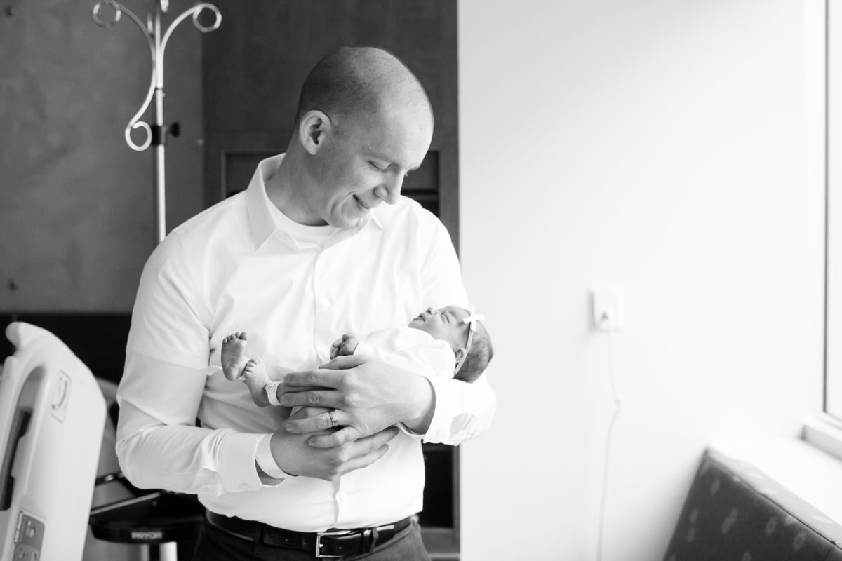 dad holding baby in hospital for fresh 48 photos