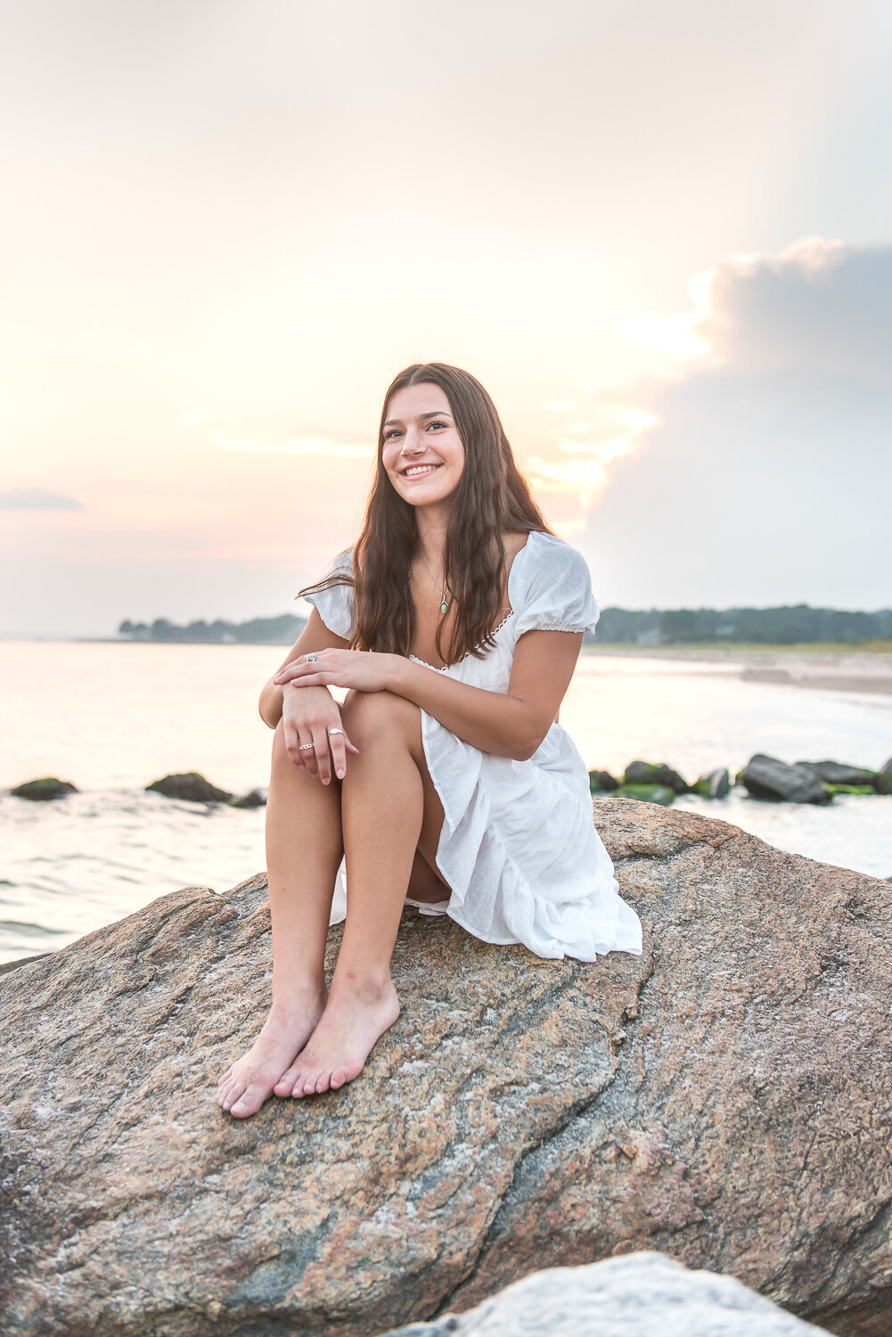 High school senior looking up at the sky on the beach in CT|Sharon Leger Photography | Canton, CT Newborn & Family Photographer