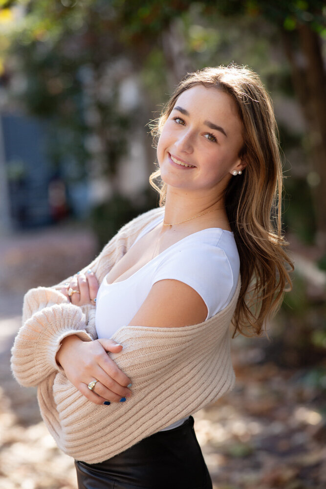 Senior session of young woman posing outside