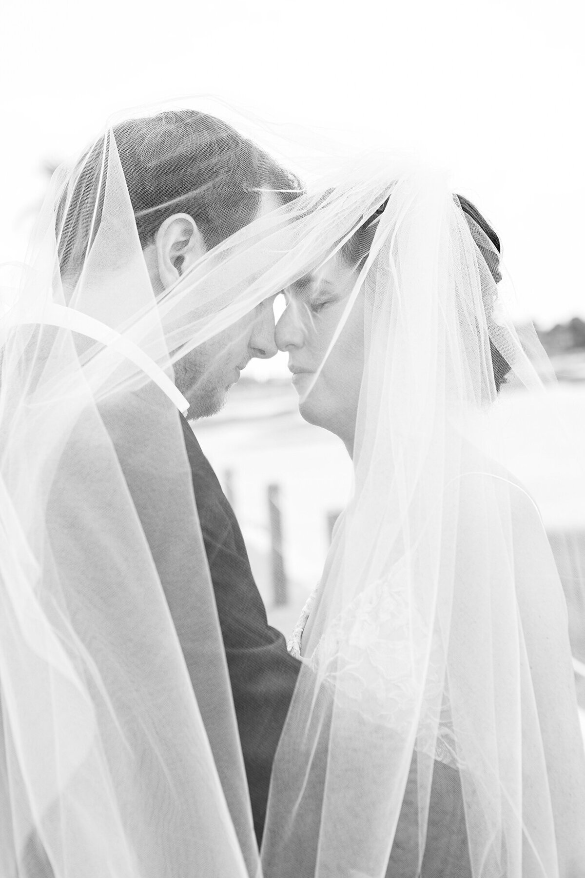 Charleston Wedding Photographer bride and groom under the veil in black and white