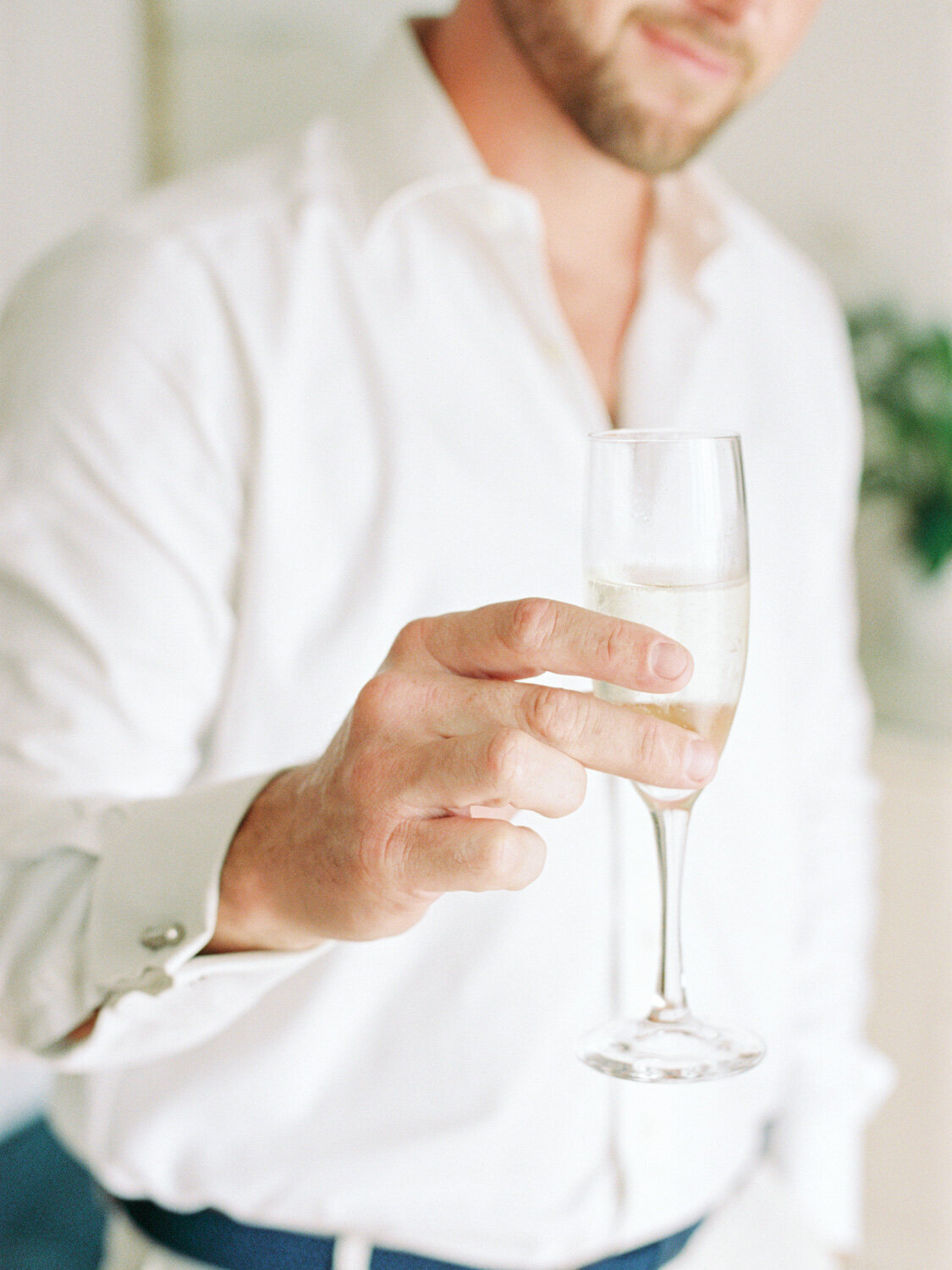 Groom with champagne glass