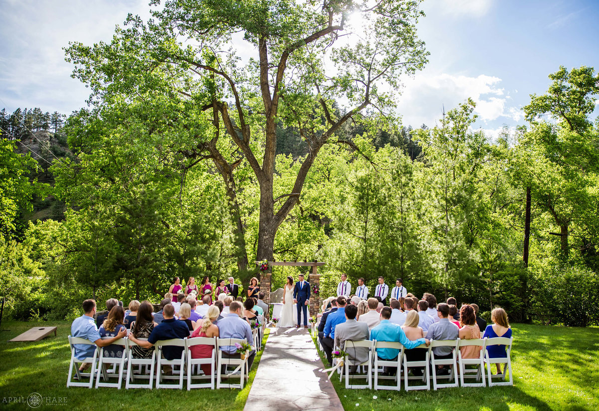 Beautiful outdoor ceremony at Wedgewood Weddings on Boulder Creek in Colorado