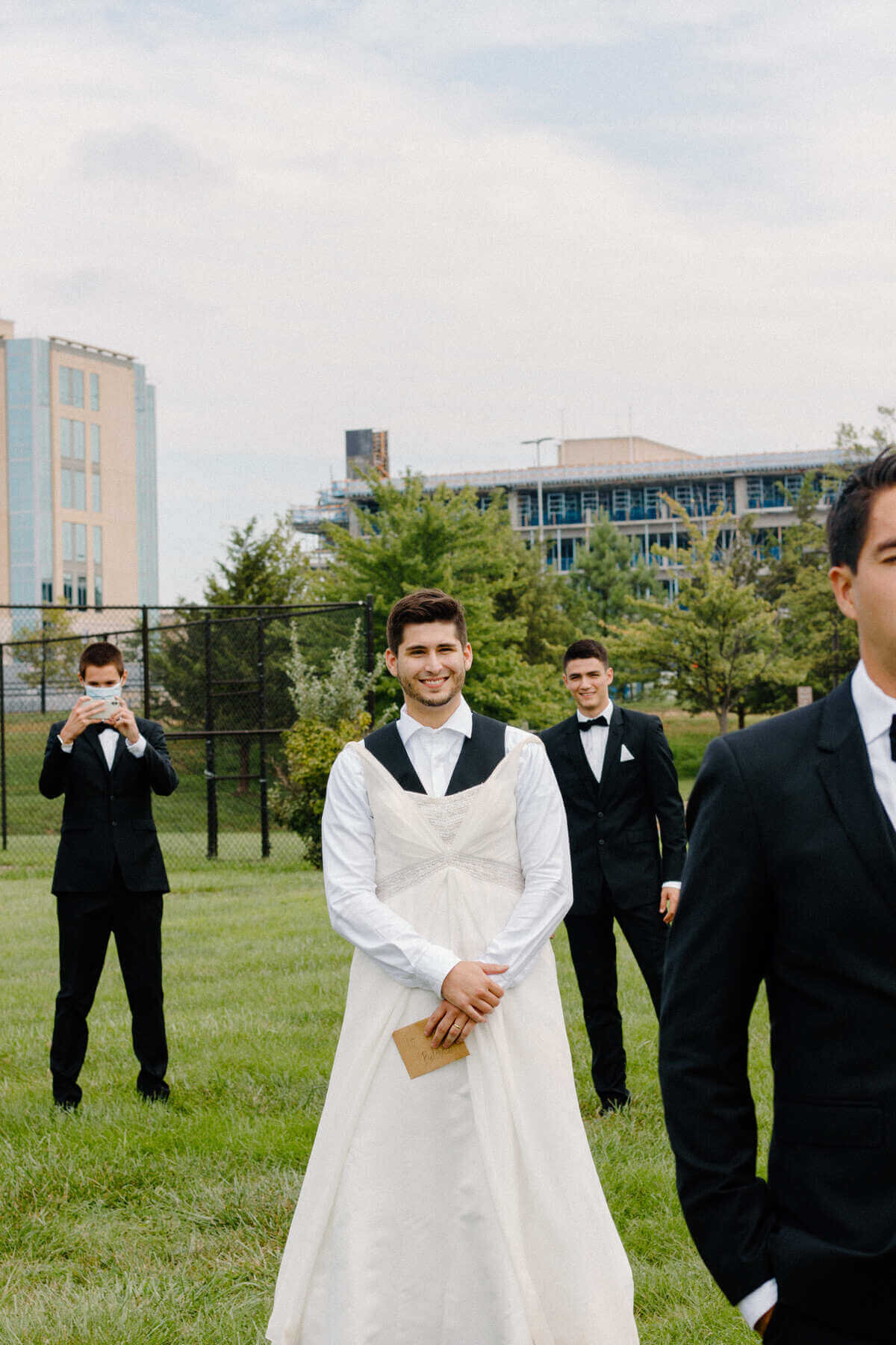 6-kara-loryn-photography-groomsmen-surprising-groom-with-first-look