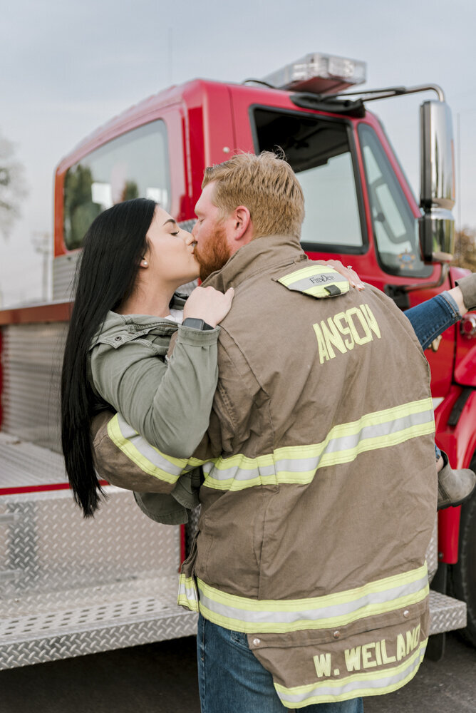 firefighter engagement photo in uniform