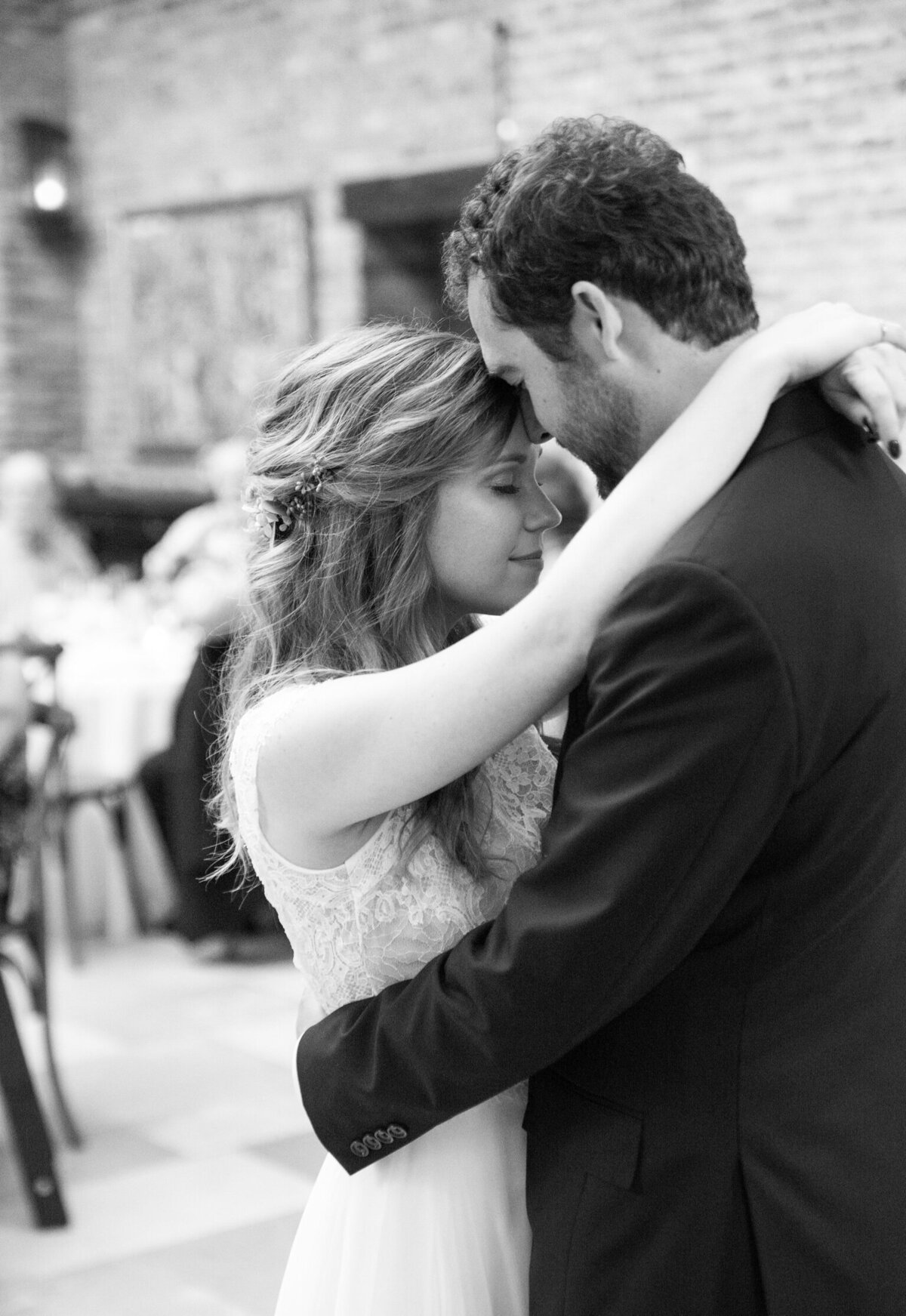 Bride and groom dance intimately