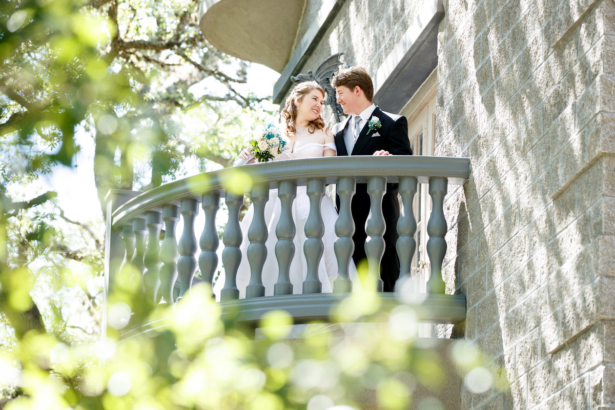 Austin wedding photographer castle avalon wedding photographer bride groom on balcony