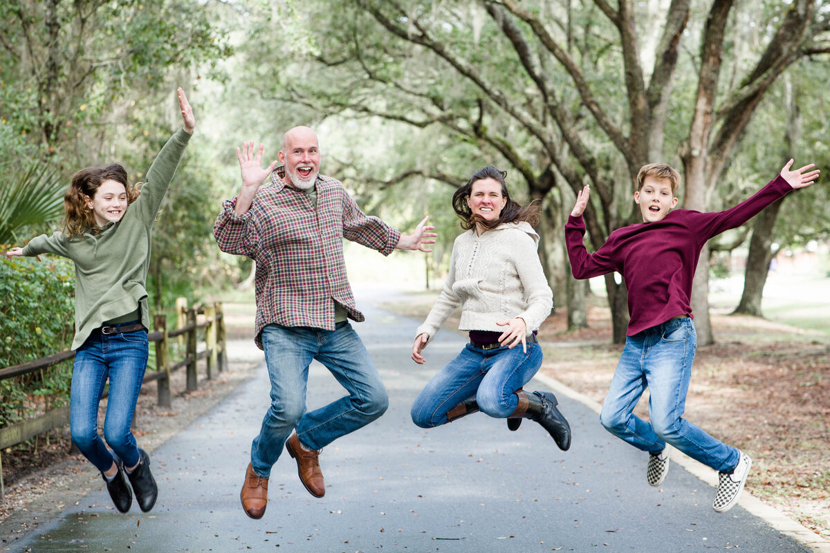 family portrait of family jumpingby Lucas Mason Photography in Orlando, Windermere, Winder Garden area